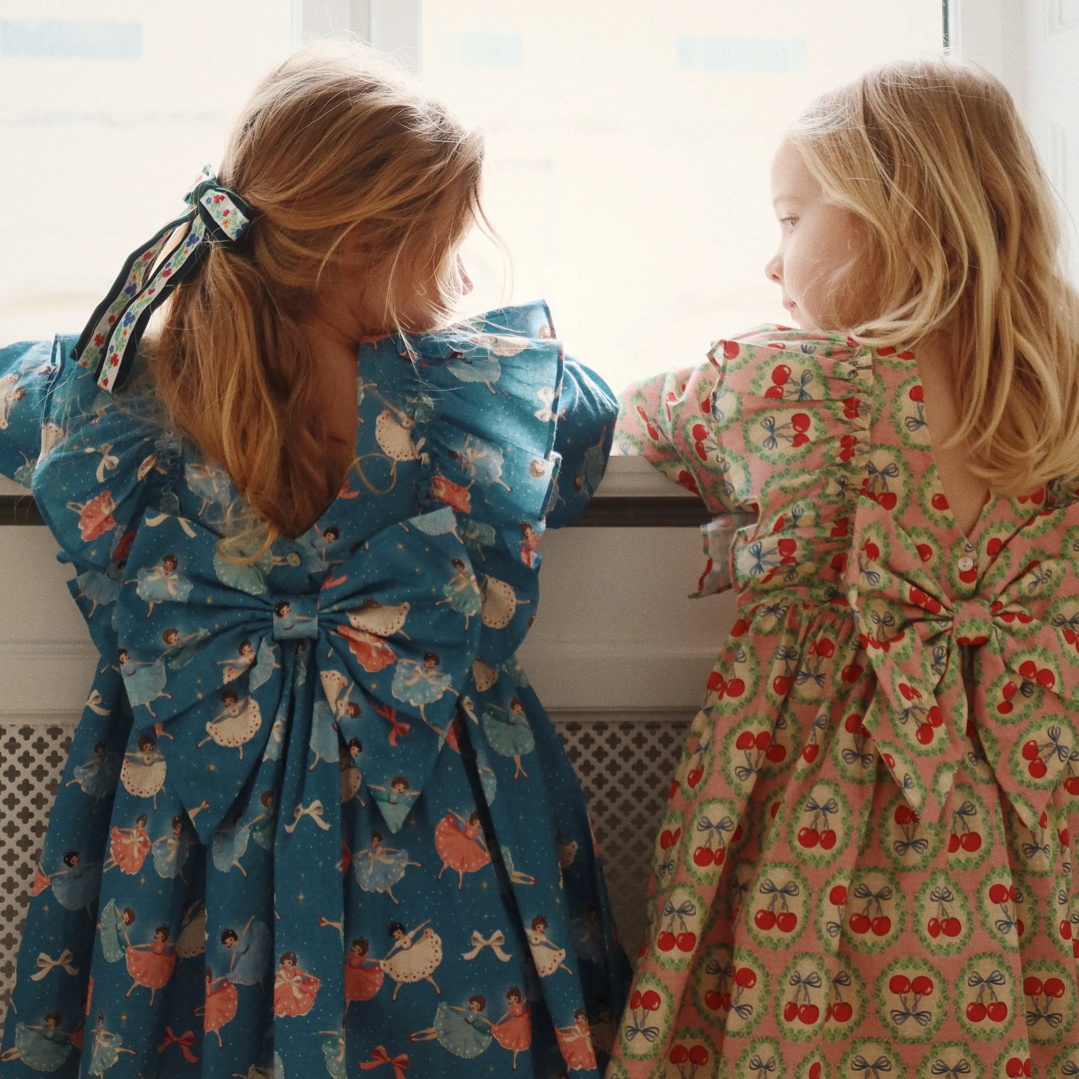 Evia Cherry Bow Print Long Sleeve Ruffle Dress