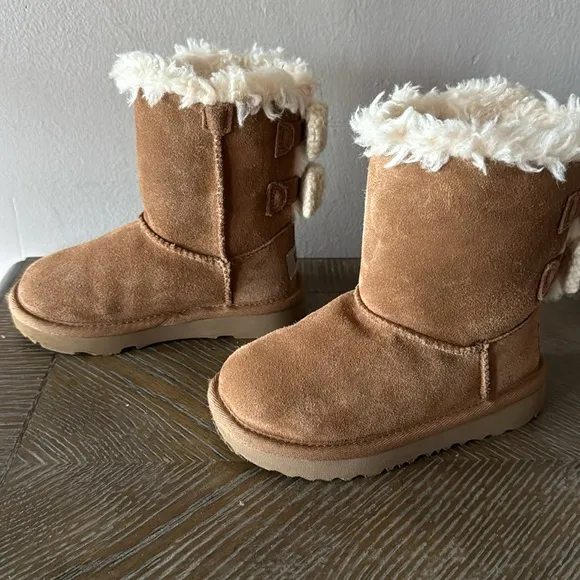 UGG camel color with crochet bows. Little girl size 9