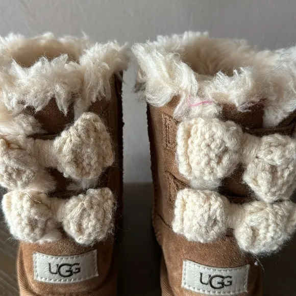 UGG camel color with crochet bows. Little girl size 9